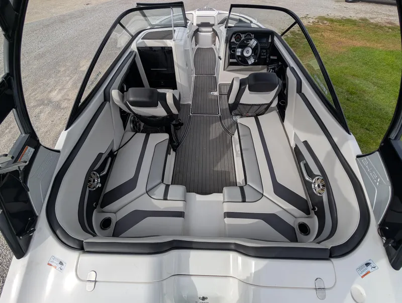 Slide: The Image of 2017 Yamaha Boats 242X E-Series interior, featuring sleek seating and modern dashboard design. - 13