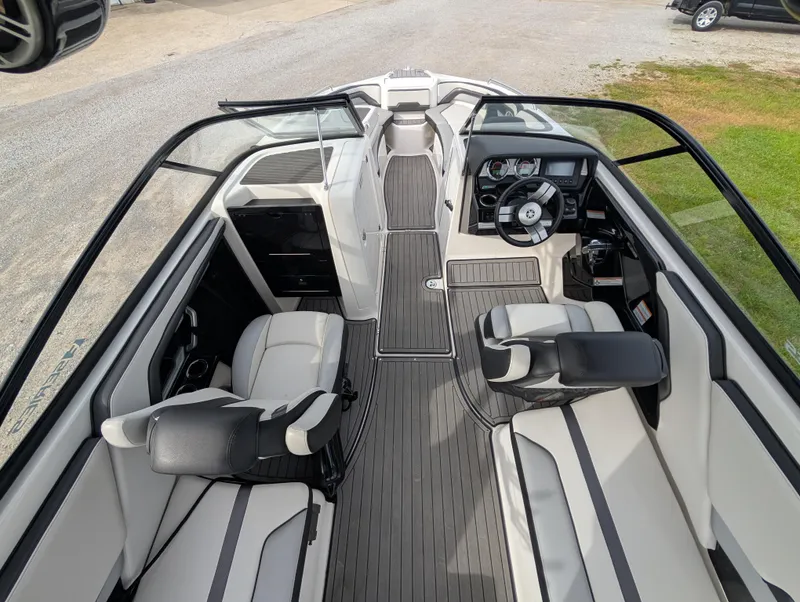 Slide: The Image of 2017 Yamaha Boats 242X E-Series interior with sleek seating and modern dashboard design. - 14