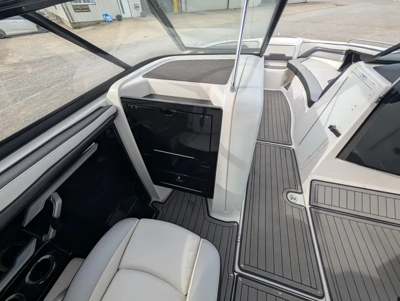 Slide: The Image of 2017 Yamaha Boats 242X E-Series interior with sleek seating and modern dashboard design. - 17