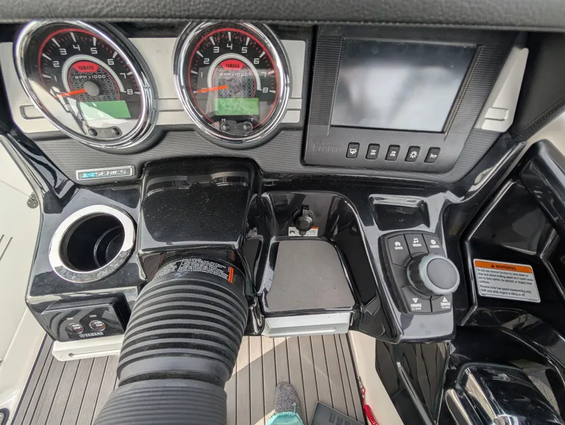 Slide: The Image of Control panel of 2017 Yamaha Boats 242X E-Series with gauges and navigation controls. - 27