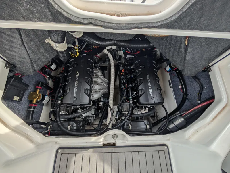 Slide: The Image of 2017 Yamaha Boats 242X E-Series engine compartment with twin high-output engines. - 32