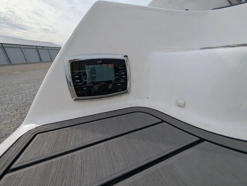 Slide: The Image of 2017 Yamaha Boats 242X E-Series dashboard with control panel, featuring sleek design and modern technology. - 35