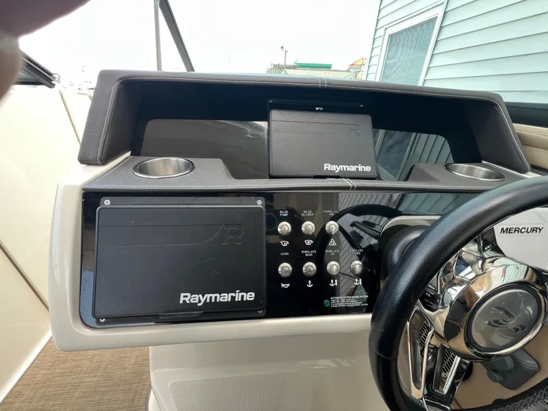 Slide: The Image of Control panel of 2017 Sea Ray SLX 350 OB with Raymarine navigation system and Mercury steering wheel. - 10