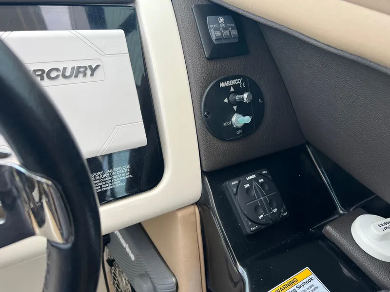 Slide: The Image of Control panel of a 2017 Sea Ray SLX 350 OB boat, featuring Mercury components. - 12