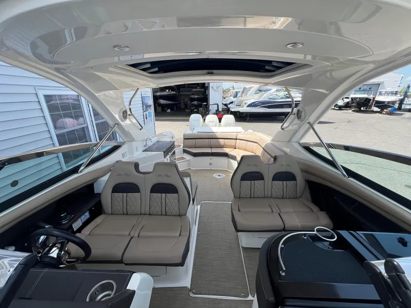 Slide: The Image of 2017 Sea Ray SLX 350 OB boat interior with luxurious seating and modern design. - 13