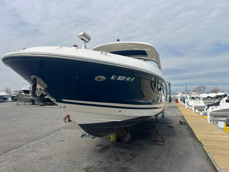 Slide: The Image of 2017 Sea Ray SLX 350 OB boat on dry dock, marina background. - 3