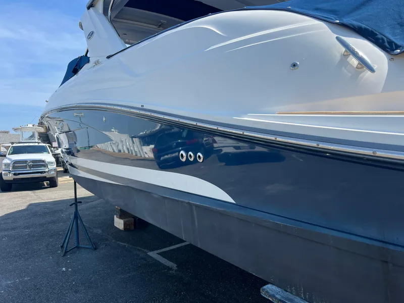 Slide: The Image of 2017 Sea Ray SLX 350 OB boat on display in a marina setting. - 36