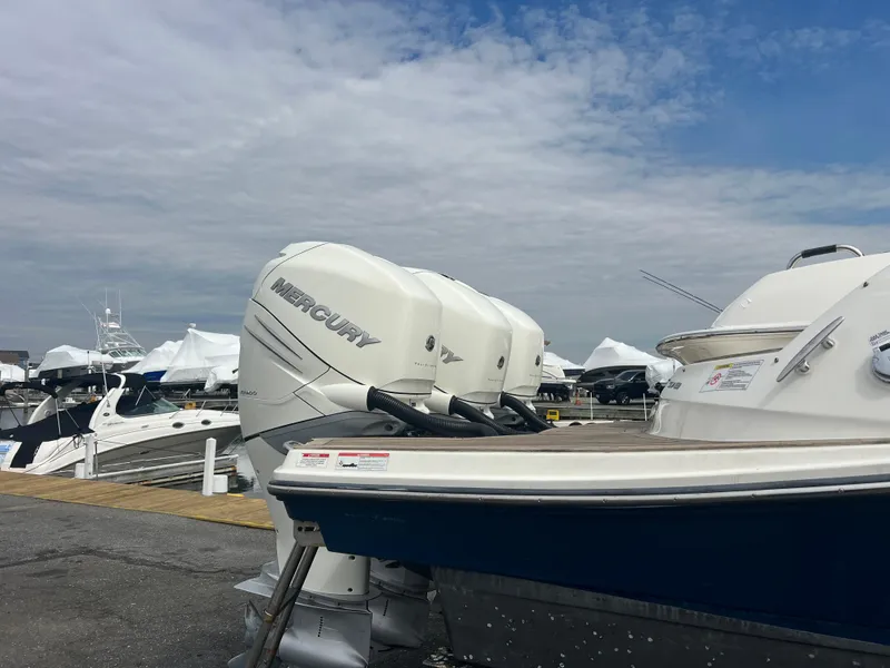 Slide: The Image of 2017 Sea Ray SLX 350 OB with Mercury outboard engines docked at a marina. - 37