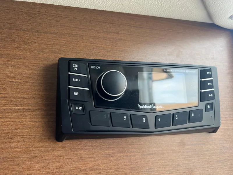 Slide: The Image of Rockford Fosgate audio system in 2017 Sea Ray SLX 350 OB boat, mounted on wooden panel. - 39