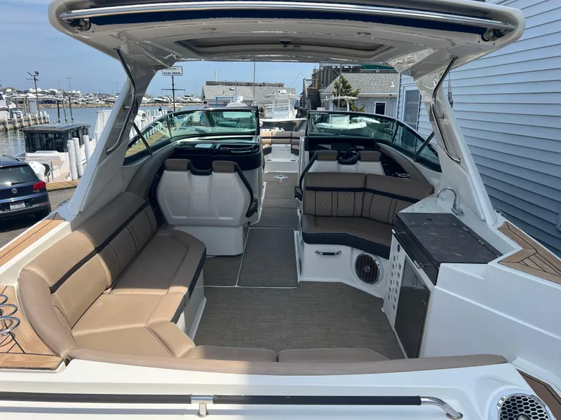 Slide: The Image of 2017 Sea Ray SLX 350 OB boat interior with spacious seating and modern design. - 4