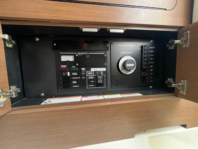 Slide: The Image of Electrical control panel inside a 2017 Sea Ray SLX 350 OB boat. - 40