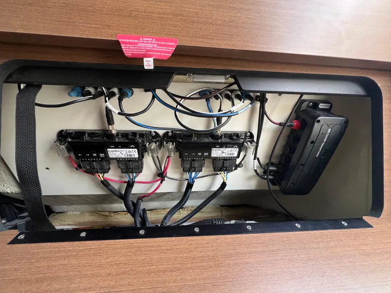 Slide: The Image of Electrical panel inside a 2017 Sea Ray SLX 350 OB boat, showcasing wiring and components. - 41