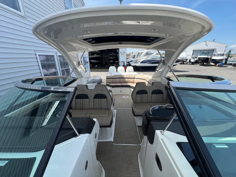 Slide: The Image of 2017 Sea Ray SLX 350 OB boat interior with spacious seating and modern design. - 6