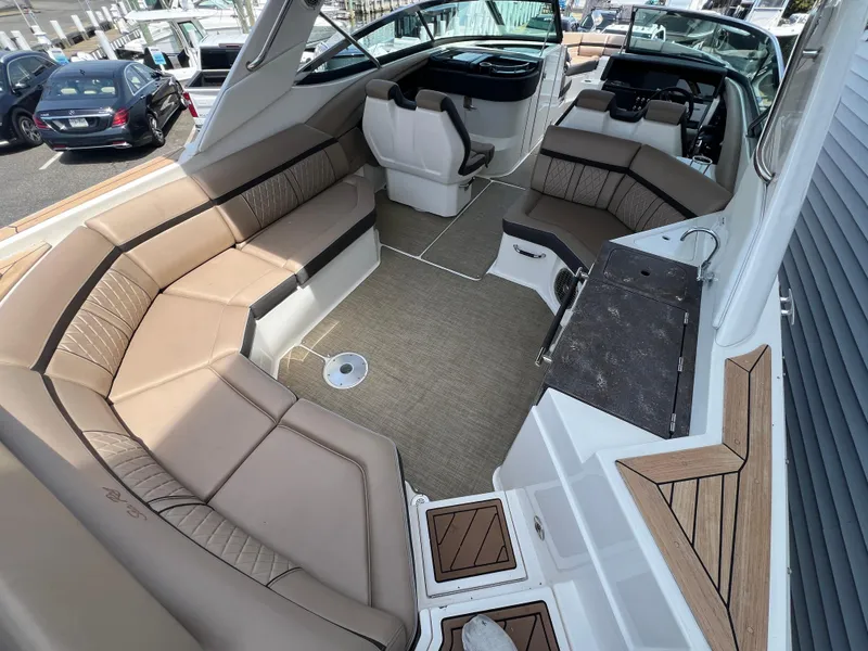 Slide: The Image of 2017 Sea Ray SLX 350 OB boat interior with spacious seating and modern design. - 8