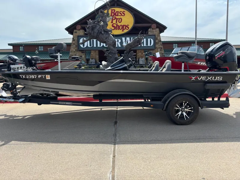 Slide: The Image of 2020 Vexus AVX1880 boat on trailer outside Bass Pro Shops Outdoor World. - 1