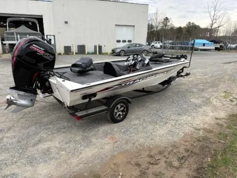 Slide: The Image of 2020 Bass Tracker Pro Team 195 boat on trailer, parked outdoors. - 3