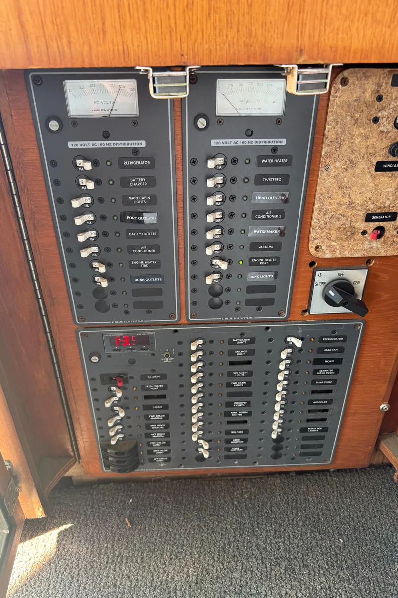 Slide: The Image of Electrical panel of a 1985 Egg Harbor Convertible boat with switches and meters. - 16