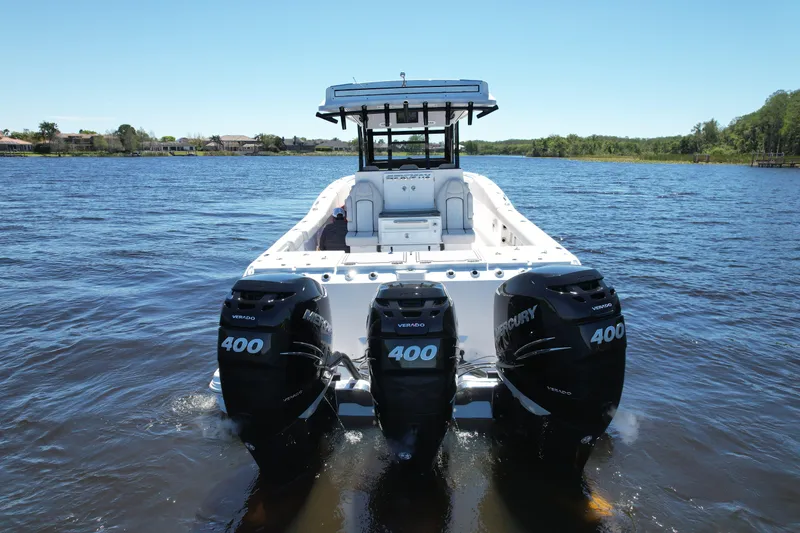 Slide: The Image of 2022 Sea Fox 368 Commander boat with triple Mercury 400 engines on a calm lake. - 10
