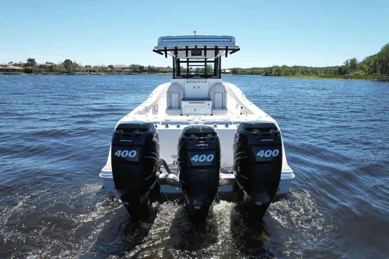 Slide: The Image of 2022 Sea Fox 368 Commander boat with triple 400 horsepower engines on a calm lake. - 11