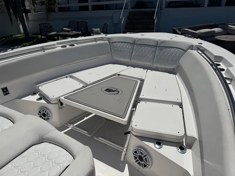 Slide: The Image of 2022 Sea Fox 368 Commander boat interior with cushioned seating and table. - 12