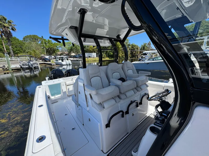 Slide: The Image of 2022 Sea Fox 368 Commander boat interior with plush seating and sleek design. - 18