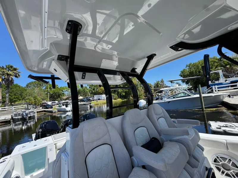 Slide: The Image of Interior view of 2022 Sea Fox 368 Commander boat with plush seating and overhead canopy. - 20
