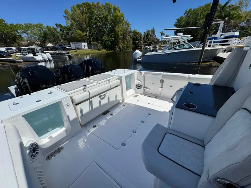 Slide: The Image of 2022 Sea Fox 368 Commander boat interior with seating and outboard motors. - 22