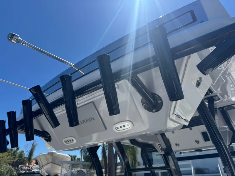 Slide: The Image of 2022 Sea Fox 368 Commander boat with rod holders and Garmin equipment under sunny sky. - 25