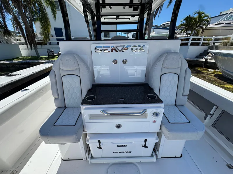 Slide: The Image of 2022 Sea Fox 368 Commander boat interior with dual seats and storage. - 26