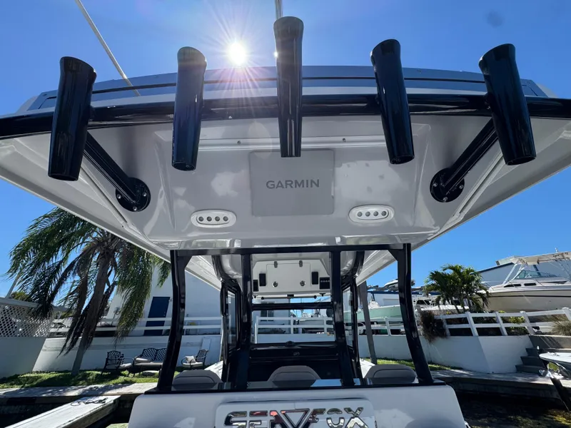 Slide: The Image of 2022 Sea Fox 368 Commander boat with Garmin equipment, viewed from below under a sunny sky. - 28