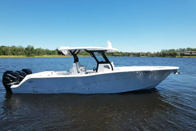 Slide: The Image of 2022 Sea Fox 368 Commander boat on calm water under clear blue sky. - 3