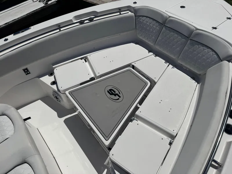 Slide: The Image of 2022 Sea Fox 368 Commander boat interior with cushioned seating and storage compartments. - 32
