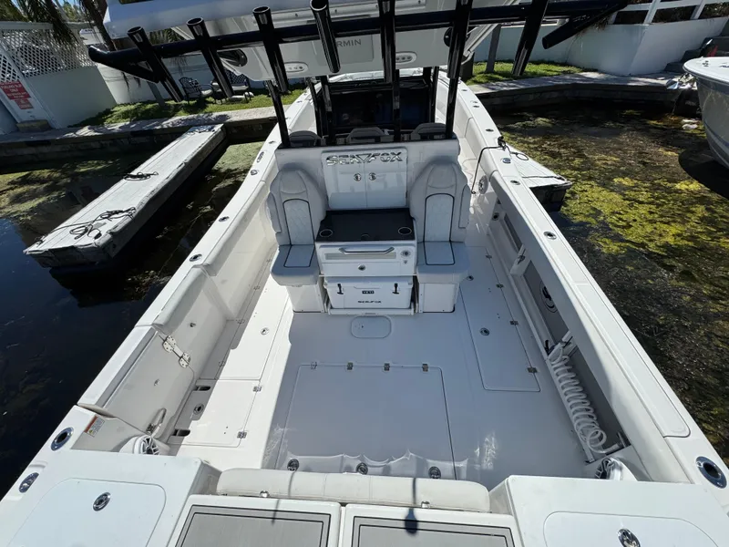 Slide: The Image of 2022 Sea Fox 368 Commander boat interior, spacious deck with seating and storage. - 36