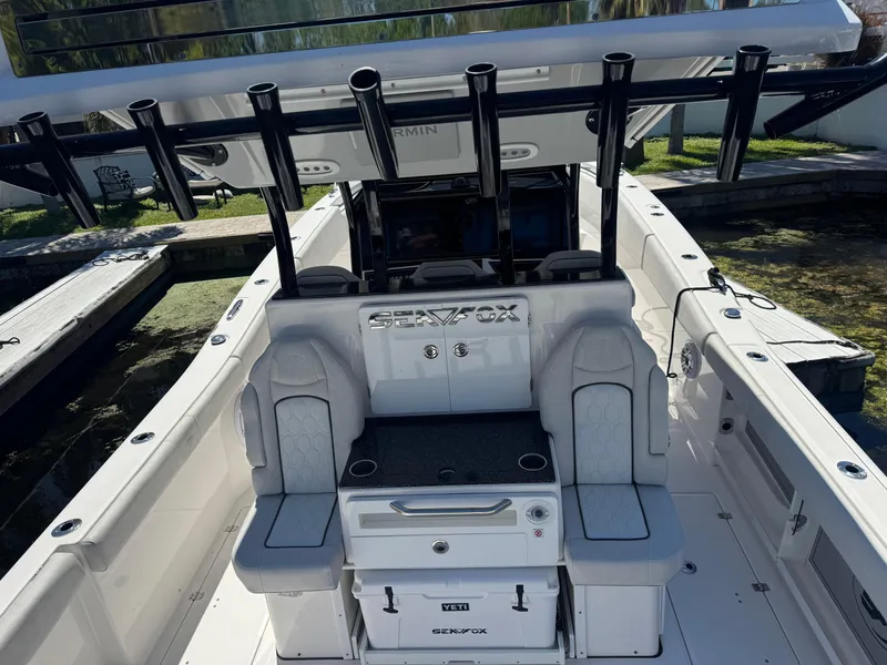 Slide: The Image of 2022 Sea Fox 368 Commander boat interior with seating and rod holders. - 38