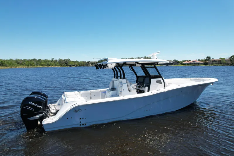 Slide: The Image of 2022 Sea Fox 368 Commander boat on calm water, featuring twin outboard engines. - 4