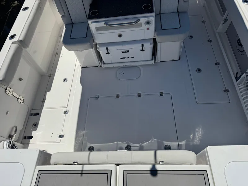 Slide: The Image of 2022 Sea Fox 368 Commander boat deck with seating and storage compartments. - 40