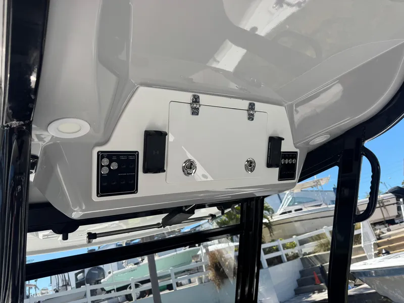 Slide: The Image of 2022 Sea Fox 368 Commander boat console with control panel and storage compartment. - 45
