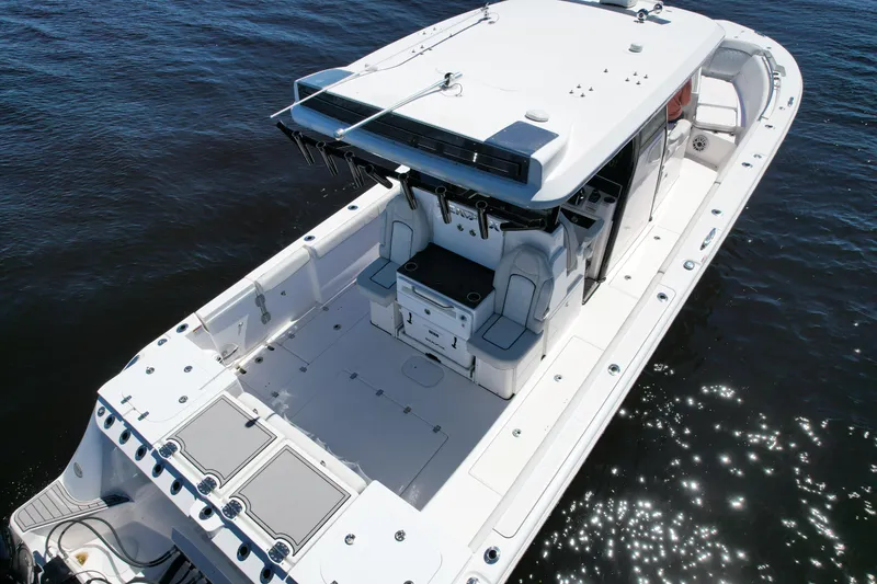 Slide: The Image of 2022 Sea Fox 368 Commander boat on water, spacious deck, sleek design. - 8