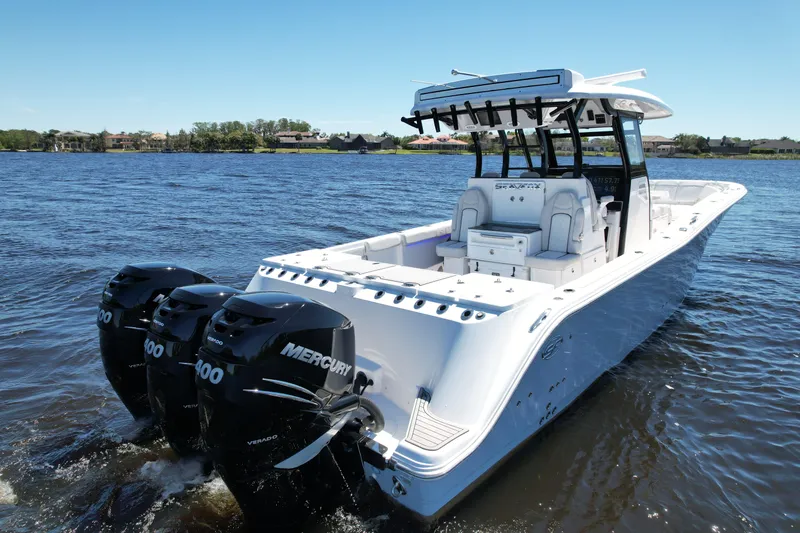 Slide: The Image of 2022 Sea Fox 368 Commander boat with triple Mercury engines on a calm lake. - 9