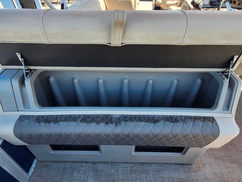 Slide: The Image of 2023 Sun Tracker Fishin' Barge 20 DLX storage compartment with cushioned seating. - 13