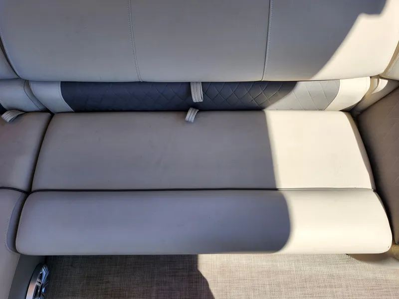 Slide: The Image of 2023 Sun Tracker Fishin' Barge 20 DLX boat seat with beige upholstery and quilted accents. - 20