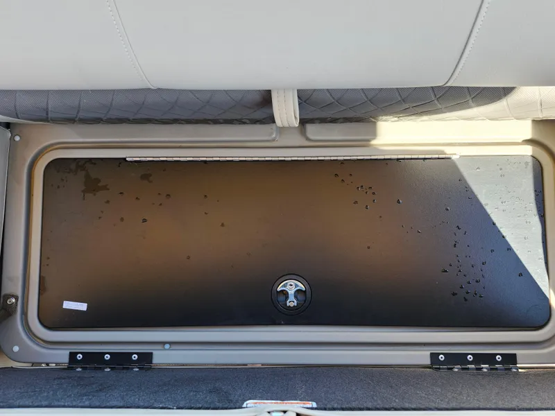 Slide: The Image of Storage compartment in 2023 Sun Tracker Fishin' Barge 20 DLX boat interior. - 21