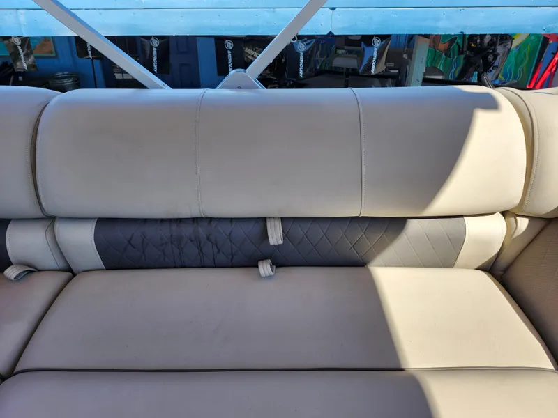 Slide: The Image of 2023 Sun Tracker Fishin' Barge 20 DLX boat seat with beige and gray upholstery. - 23