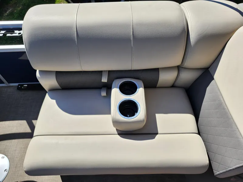 Slide: The Image of 2023 Sun Tracker Fishin' Barge 20 DLX boat seat with built-in cup holders. - 27