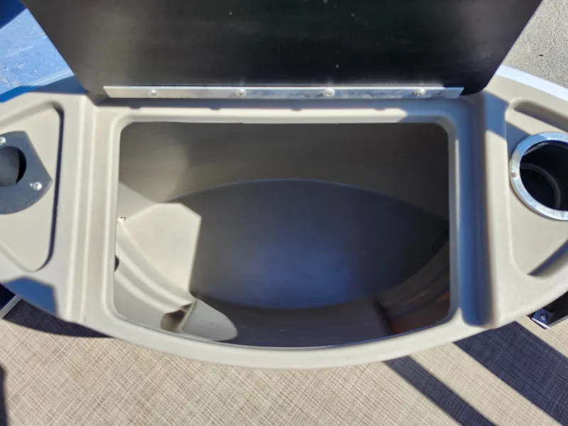 Slide: The Image of Open storage compartment on 2023 Sun Tracker Fishin' Barge 20 DLX boat. - 32