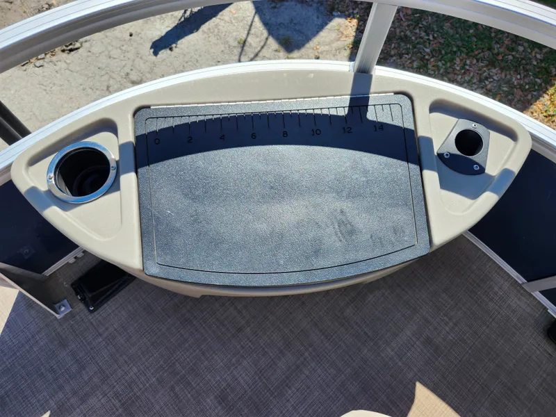 Slide: The Image of 2023 Sun Tracker Fishin' Barge 20 DLX fishing station with cup holders and measuring board. - 33