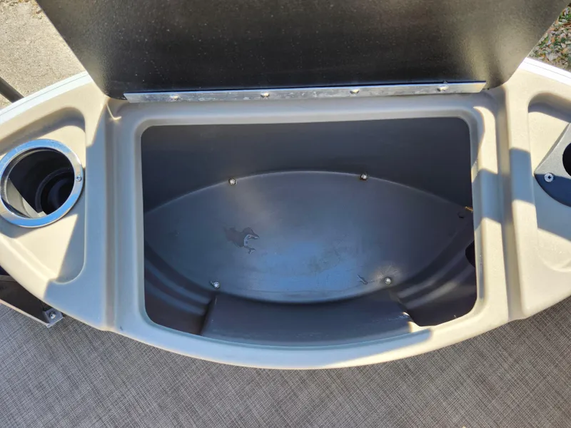 Slide: The Image of Open storage compartment on 2023 Sun Tracker Fishin' Barge 20 DLX boat. - 34