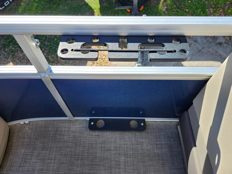 Slide: The Image of 2023 Sun Tracker Fishin' Barge 20 DLX interior with rod holder and seating. - 35