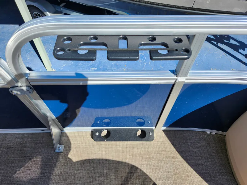 Slide: The Image of 2023 Sun Tracker Fishin' Barge 20 DLX boat railing with mounted accessory holder. - 36