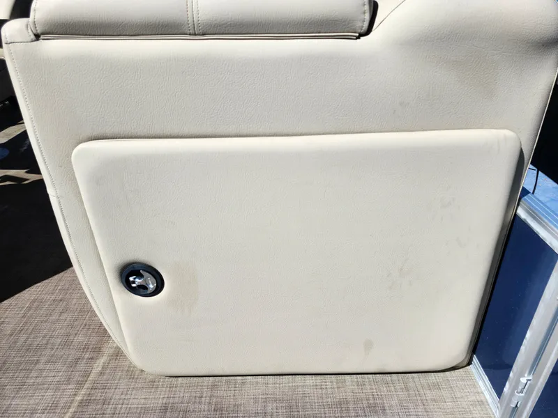 Slide: The Image of 2023 Sun Tracker Fishin' Barge 20 DLX beige interior panel with latch. - 37